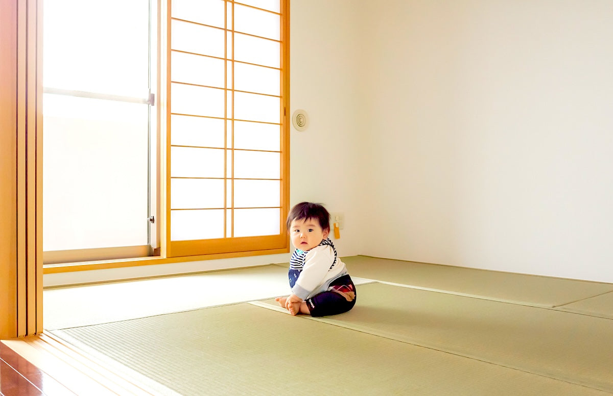 baby sitting on tatami